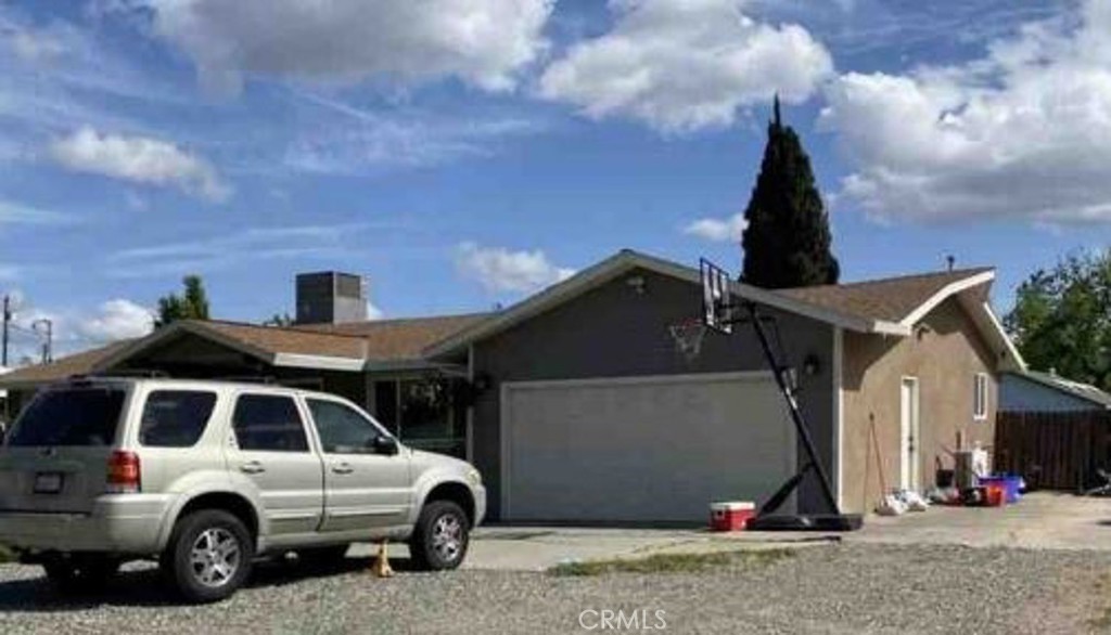 a view of a car parked in front of a house