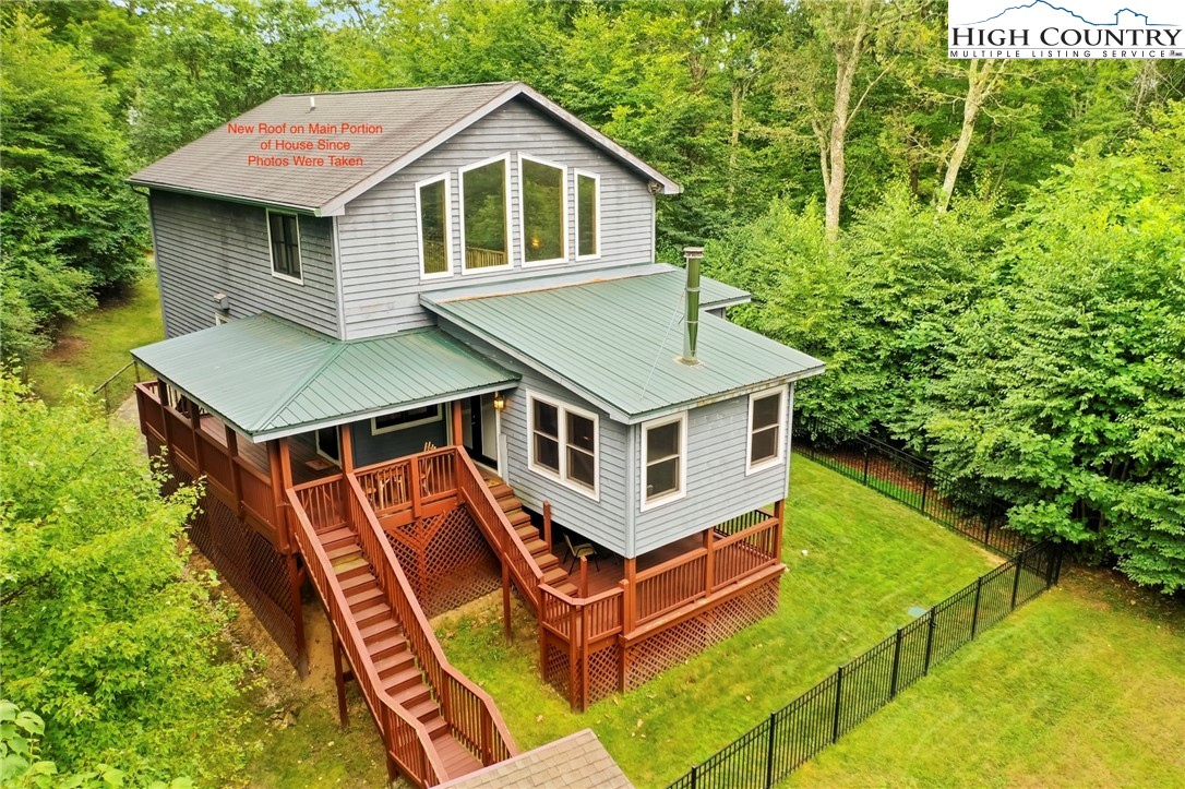 a aerial view of a house with pool