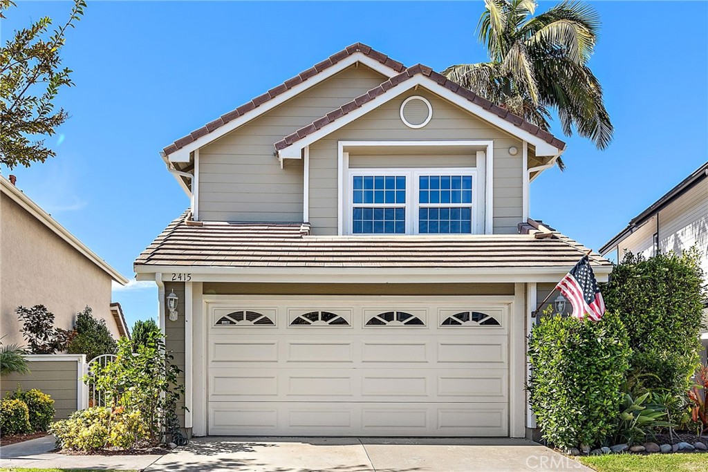 a front view of a house with a garage