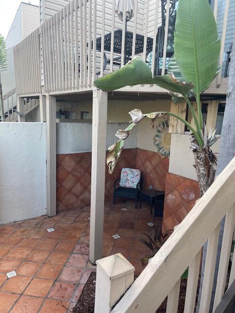 a view of a balcony with a potted plants