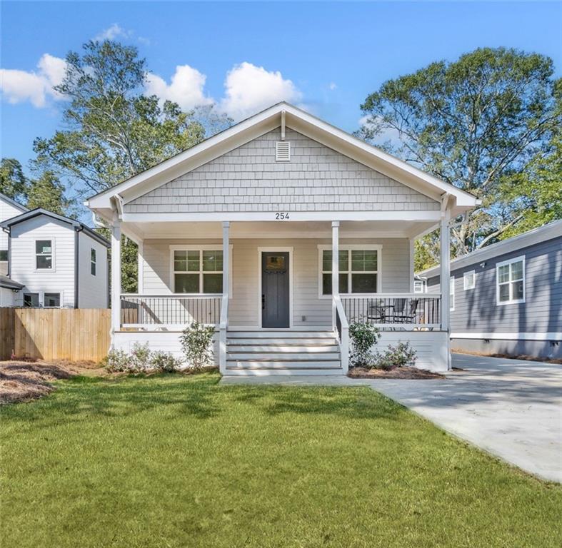 a front view of a house with yard