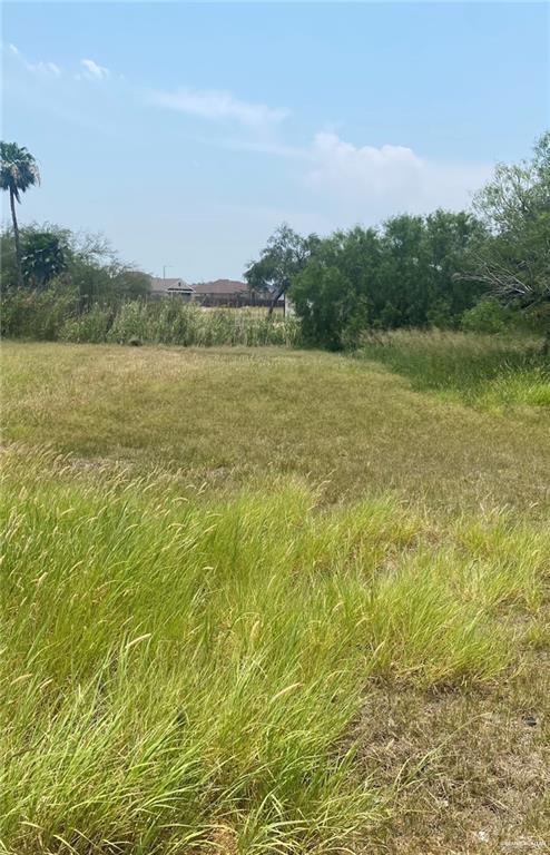 a view of lake with green field