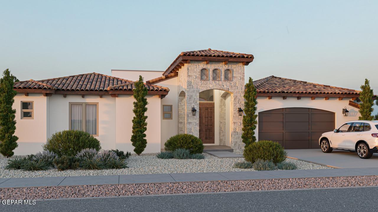 a front view of a house with a garage