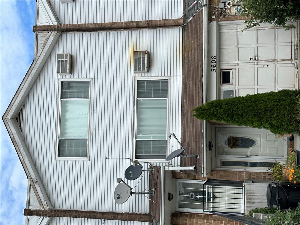 a view of the house with a door and a large window