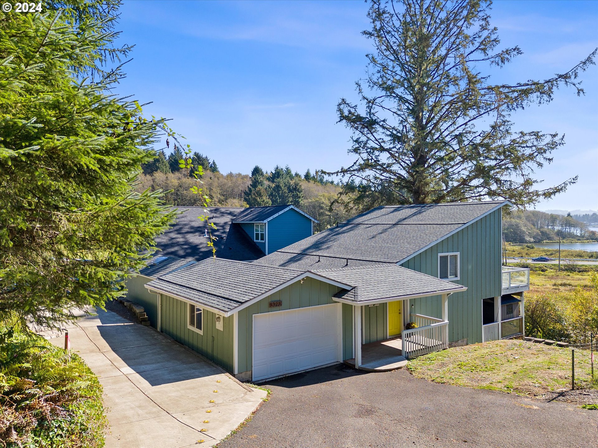 a aerial view of a house with a yard