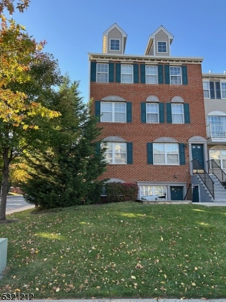 a front view of building with yard