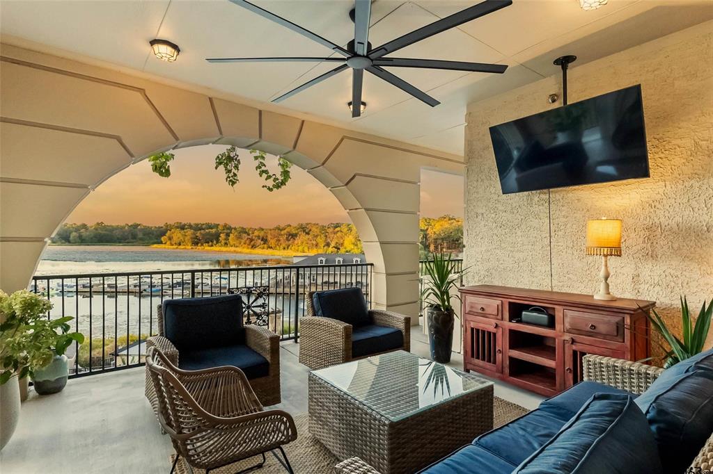 a roof deck with table and chairs