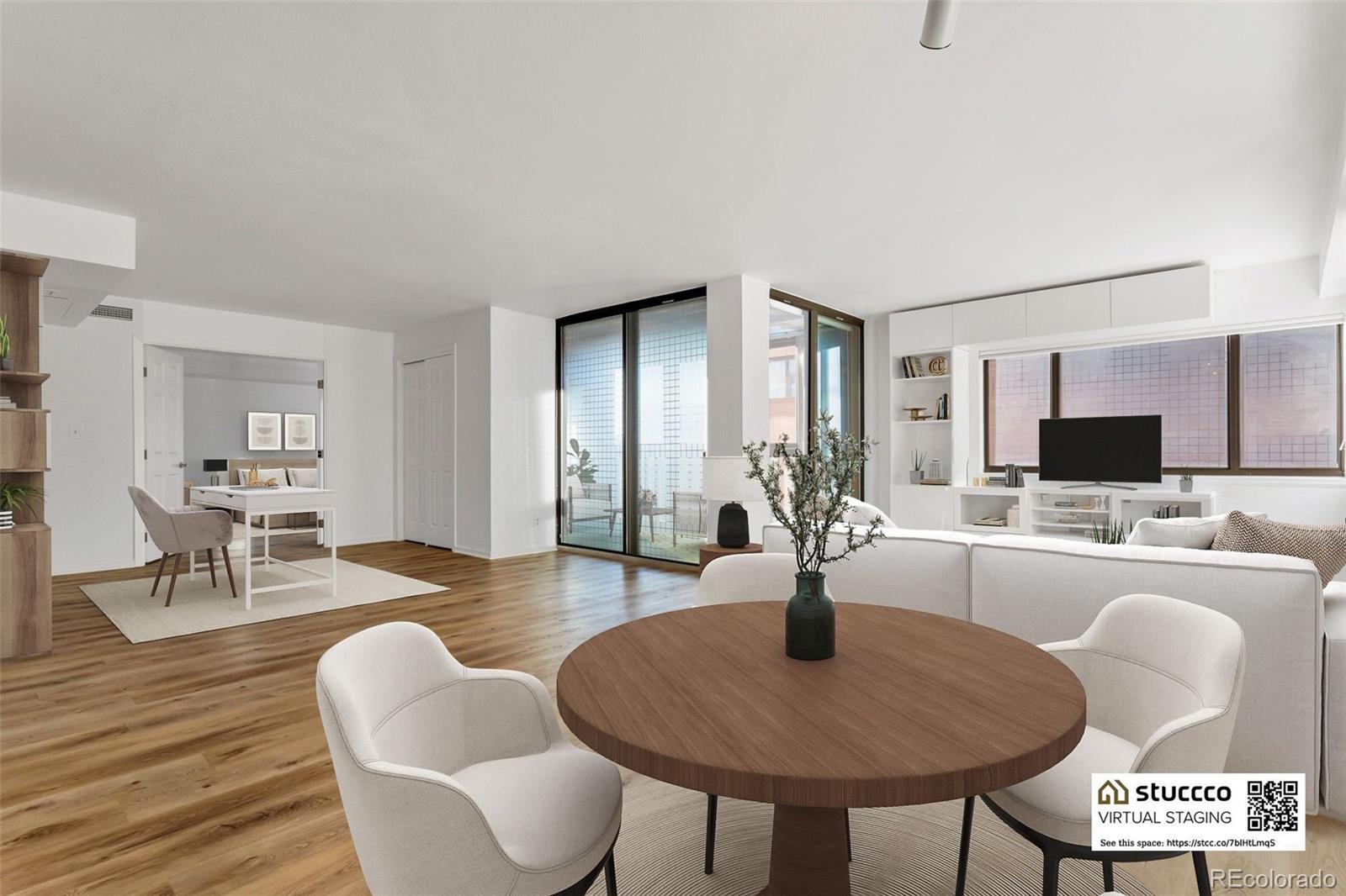 a view of a dining room with furniture and wooden floor