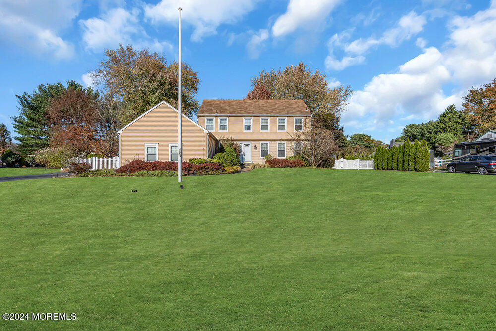 a view of a house with a yard