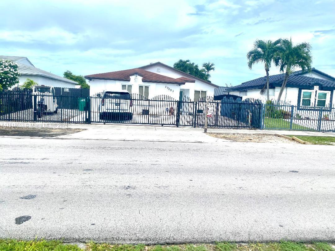 a front view of residential houses with yard