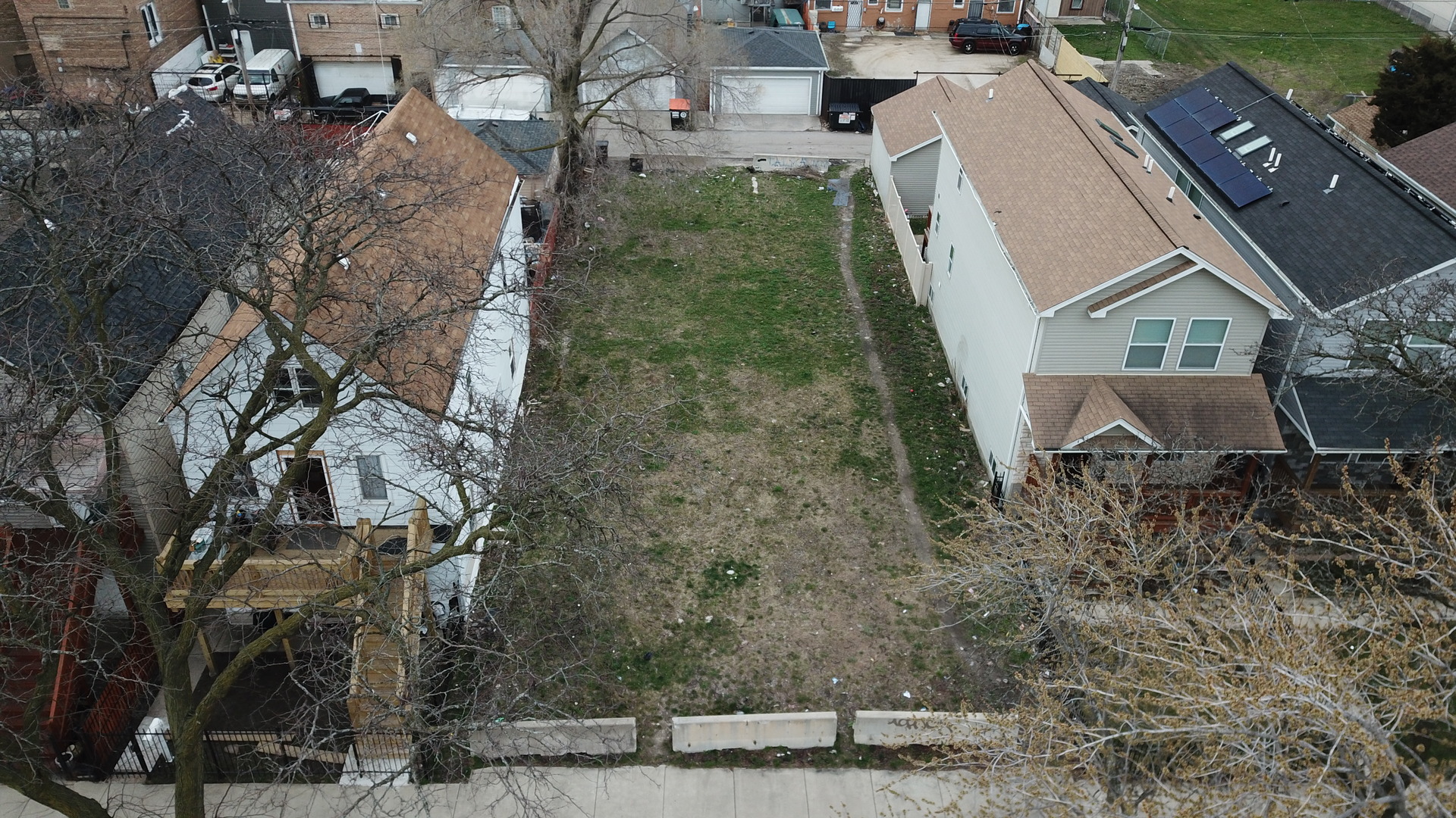 a aerial view of a house with a yard