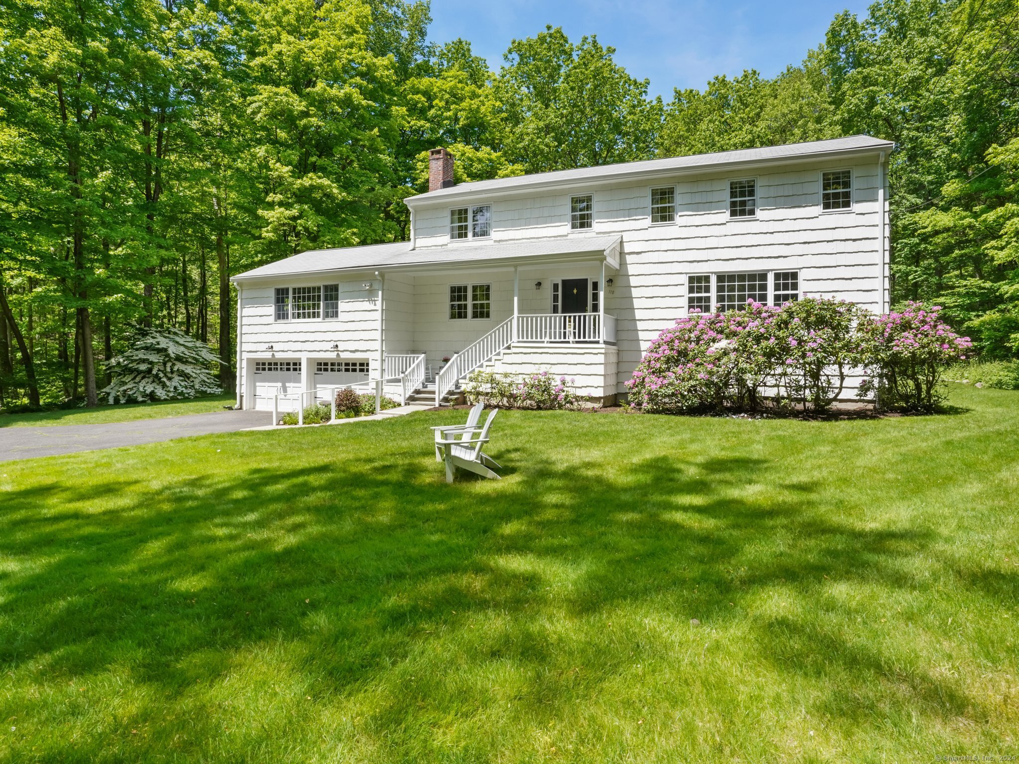Lovely colonial home nestled on 4.5 private, tranquil acres