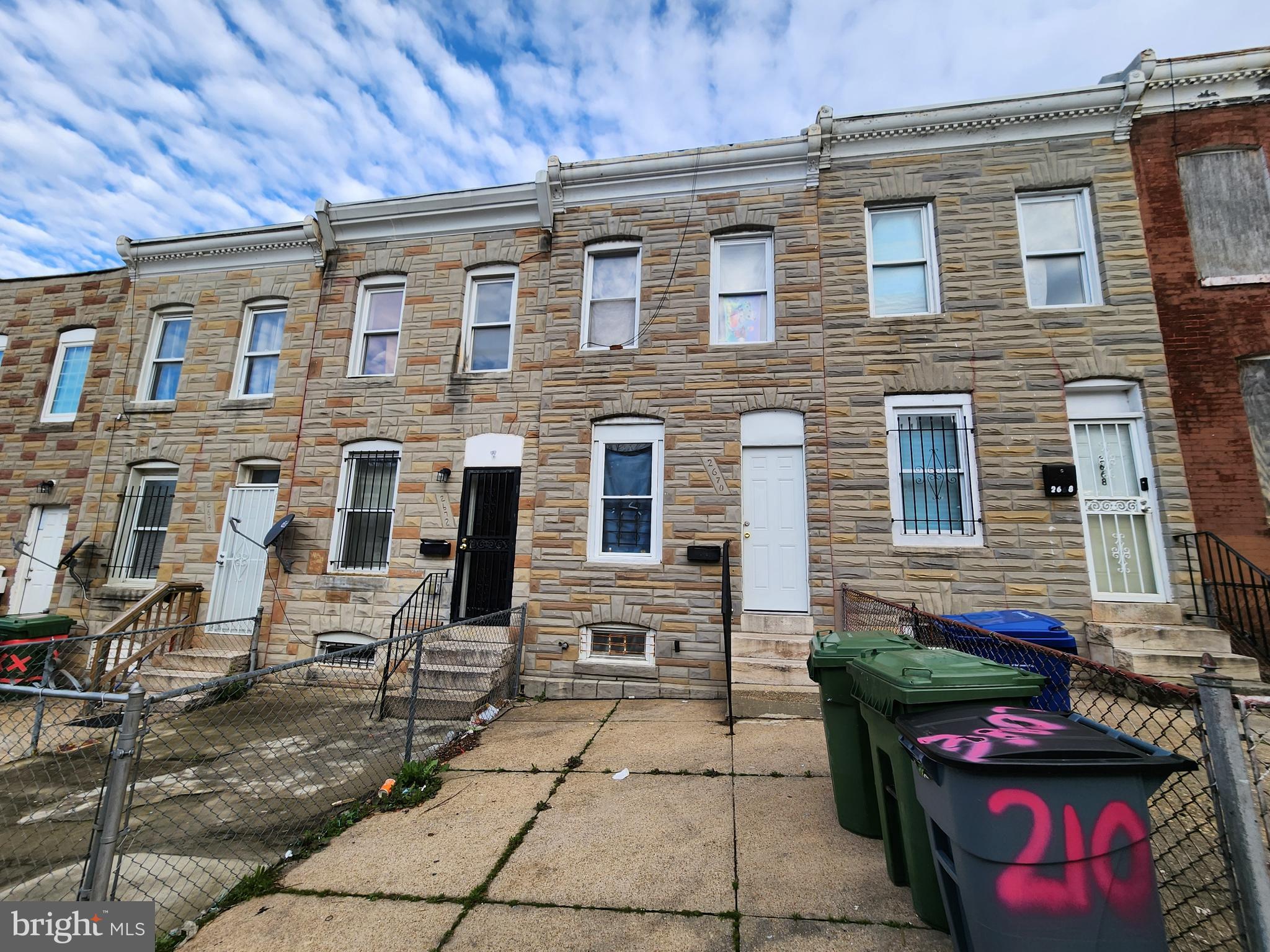 a front view of a house with parking