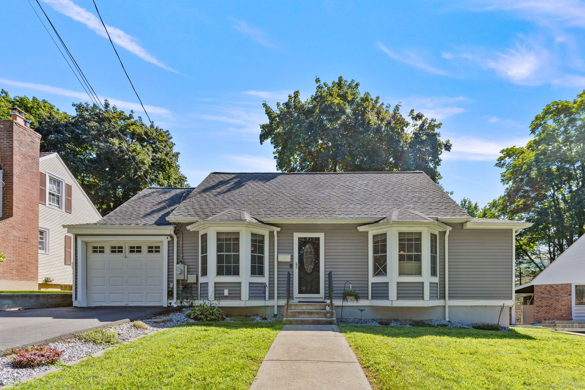 front view of a house with a yard