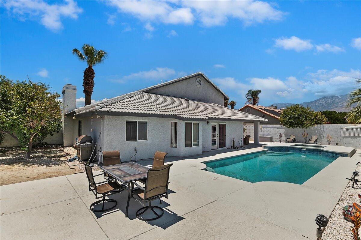 a view of a house with pool table and chairs