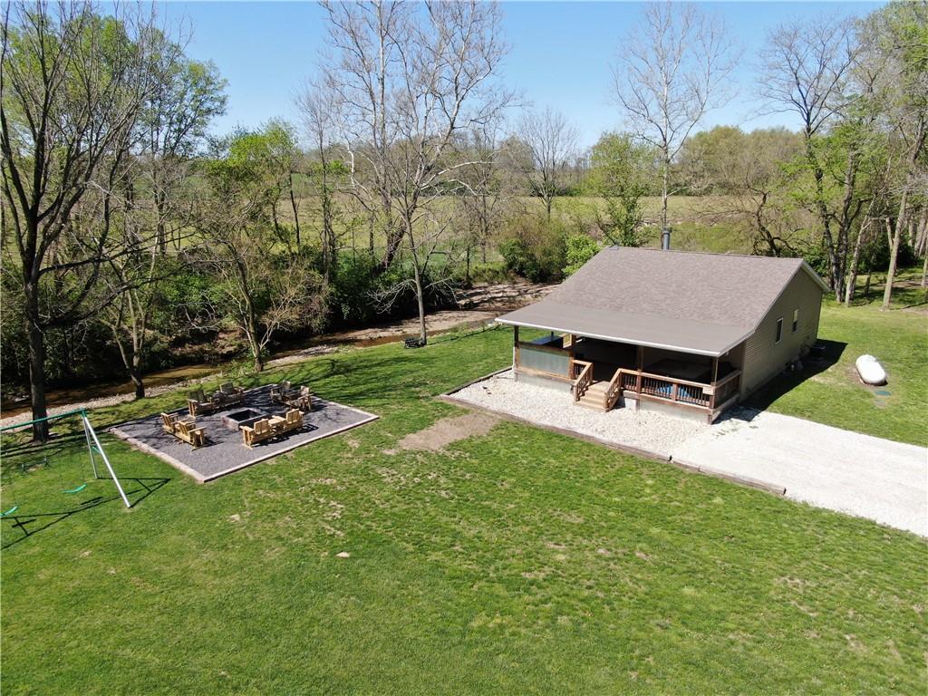 a view of a backyard with sitting area