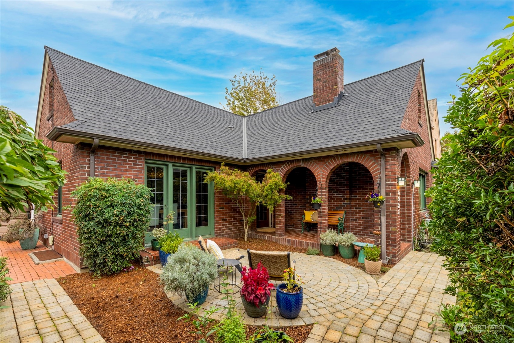 a front view of a house with garden