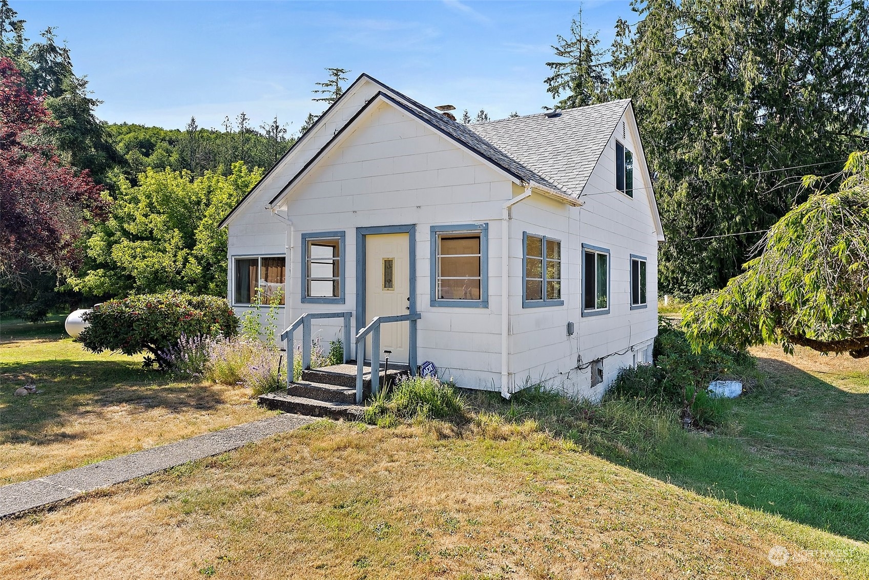 a front view of a house with a yard