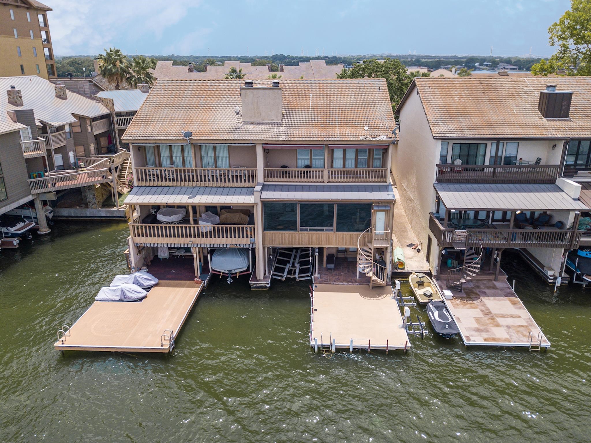 an aerial view of a house with swimming pool and a terrace