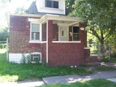 a view of a brick house with a yard