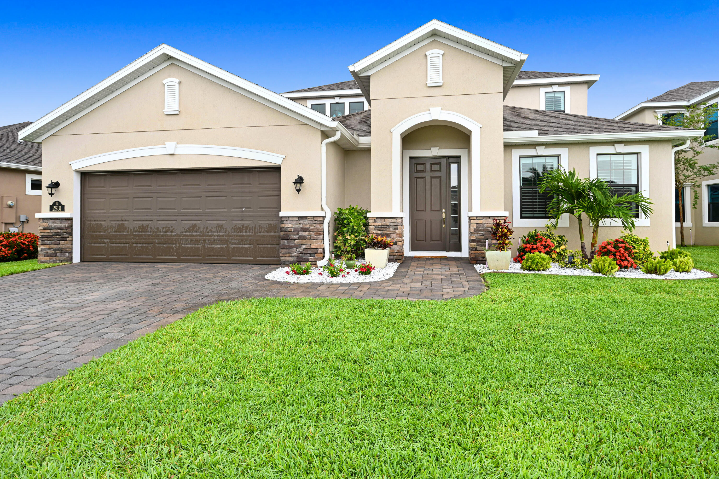 a front view of a house with garden