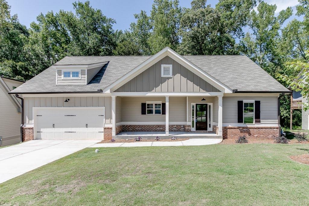 a front view of a house with a yard