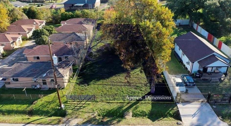 an aerial view of multiple houses with yard