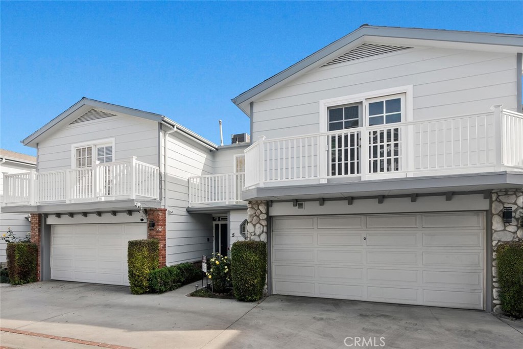 a front view of a house with garage