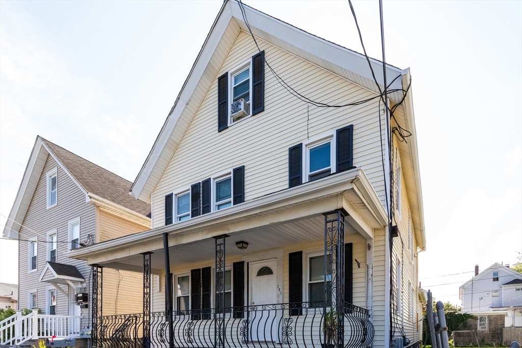 a view of a house with a street