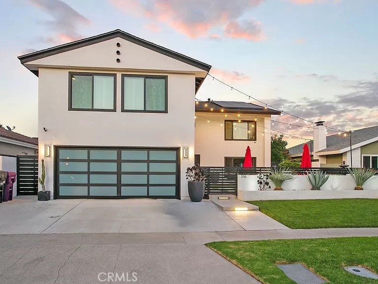 a front view of a house with a garage and a garage