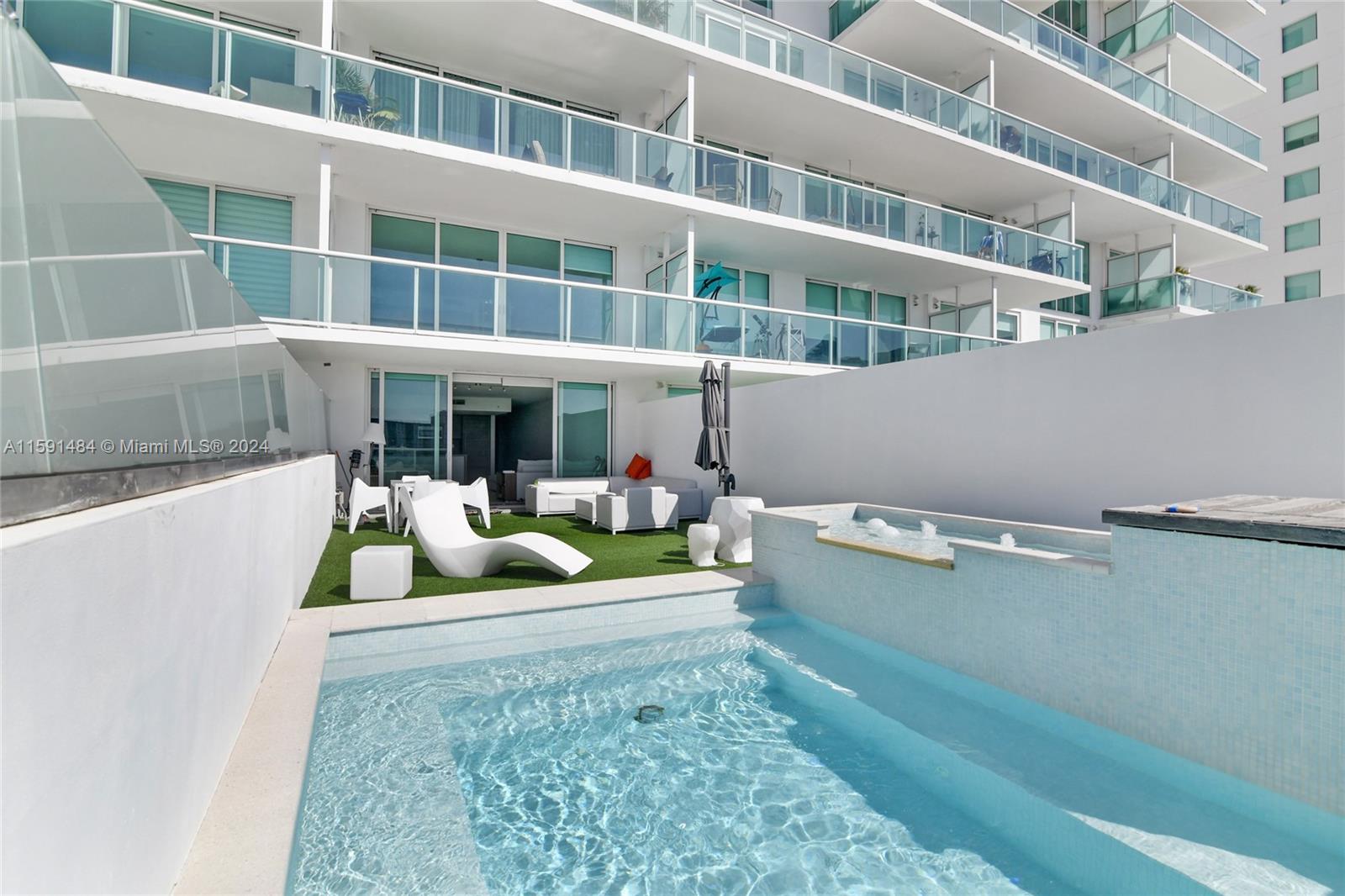 a view of swimming pool with outdoor seating