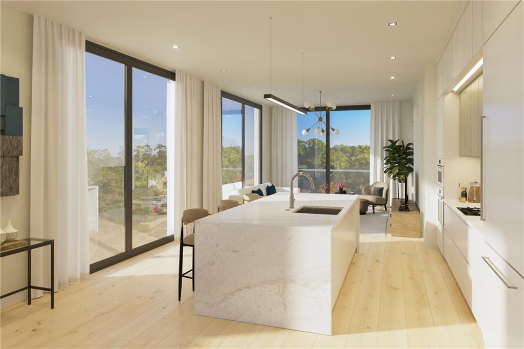 a living room with large windows and a table