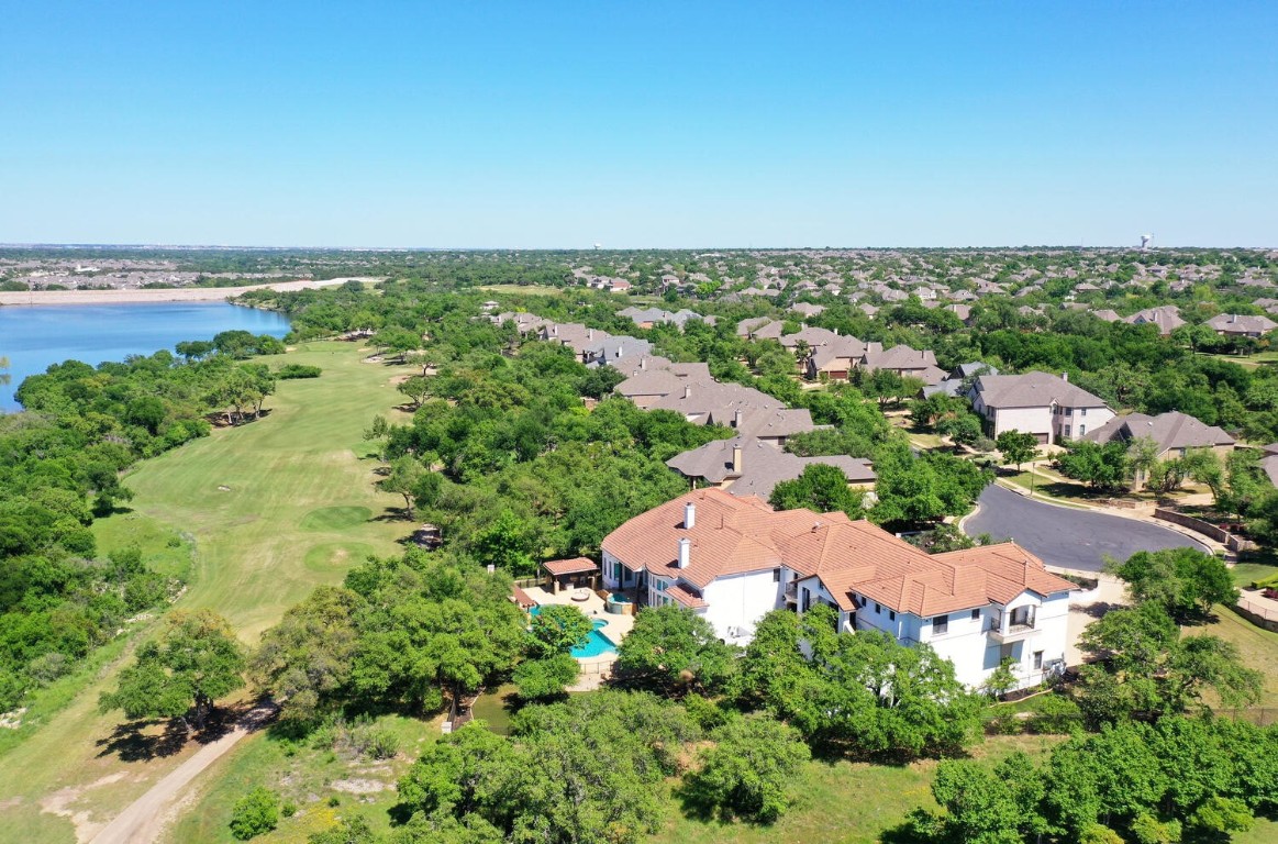 an aerial view of a house with a yard