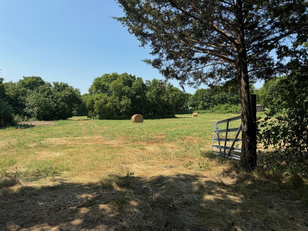 a view of a lake with a yard