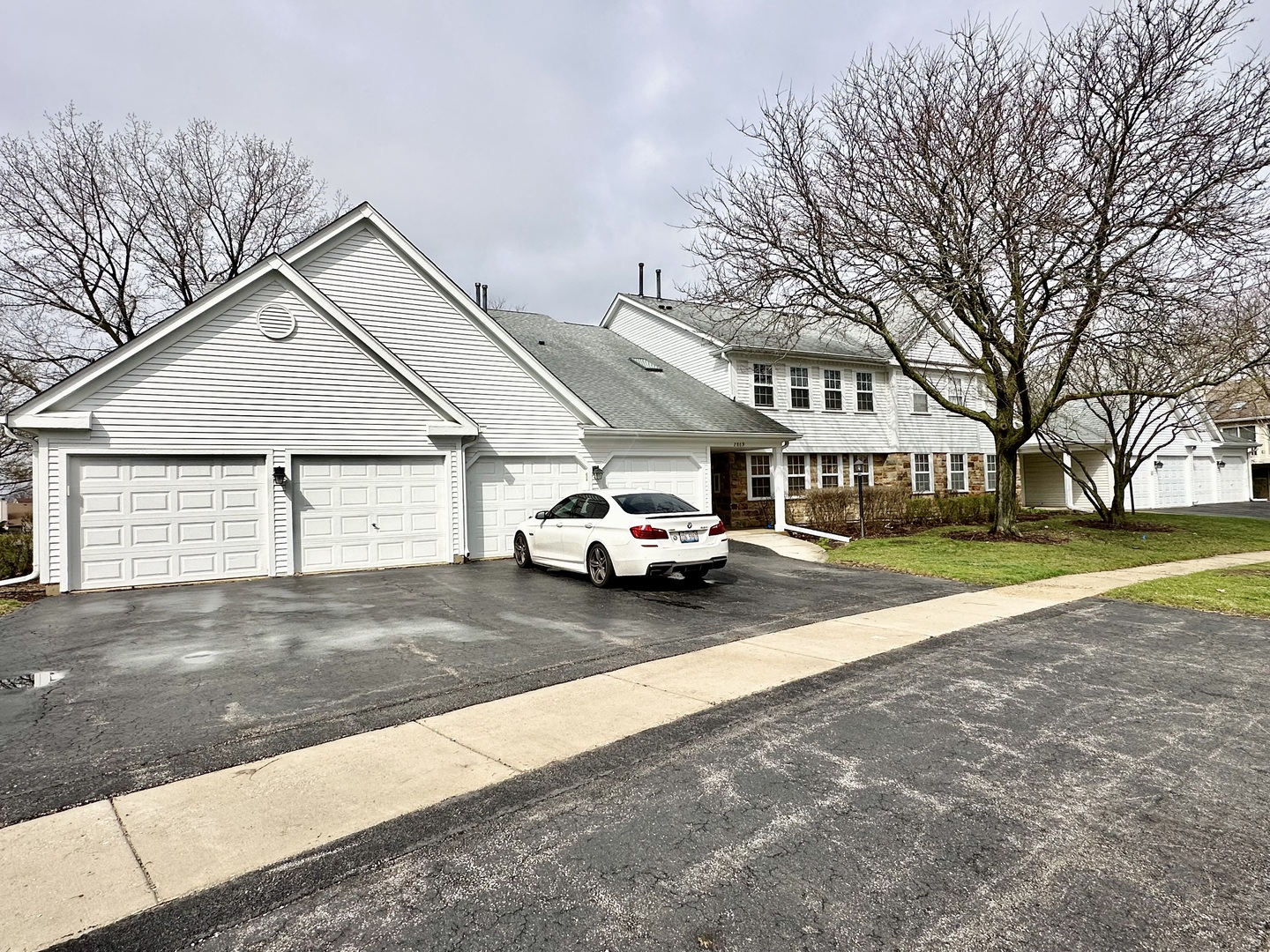 a view of a house with a yard and garage