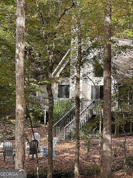 a view of a house with large tree