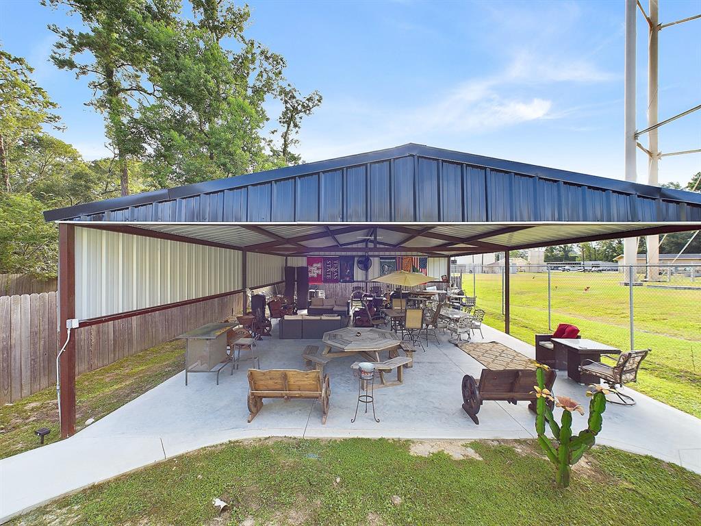 a view of a backyard with sitting area