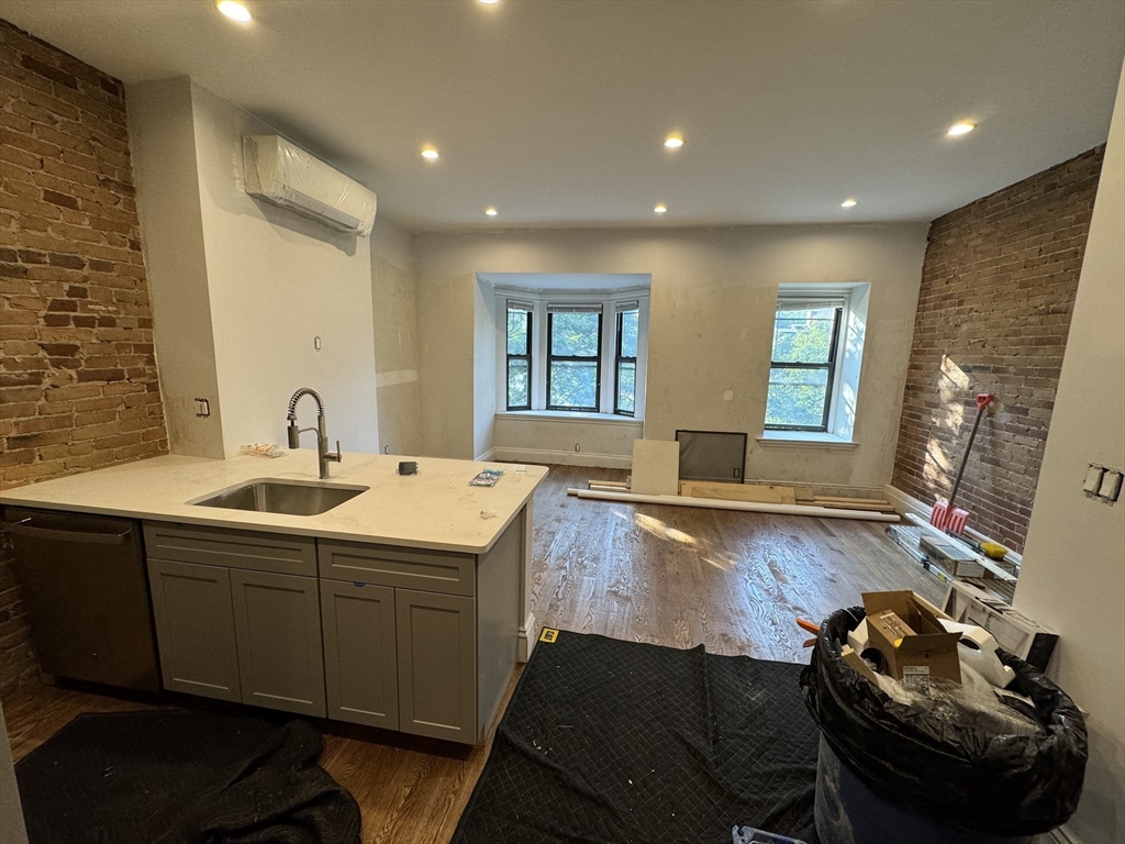 a spacious bathroom with a double vanity sink and a mirror