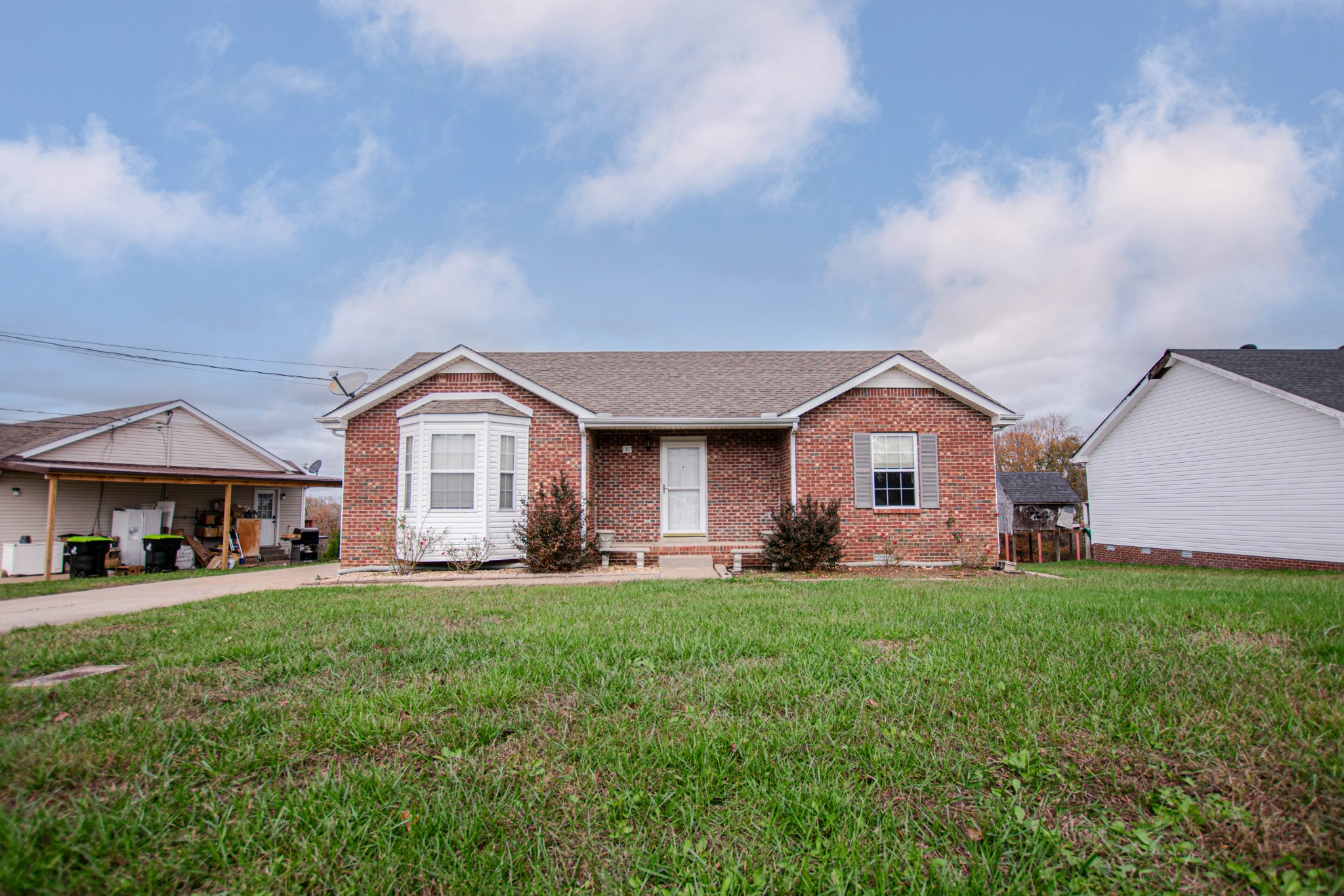 a front view of a house with a yard