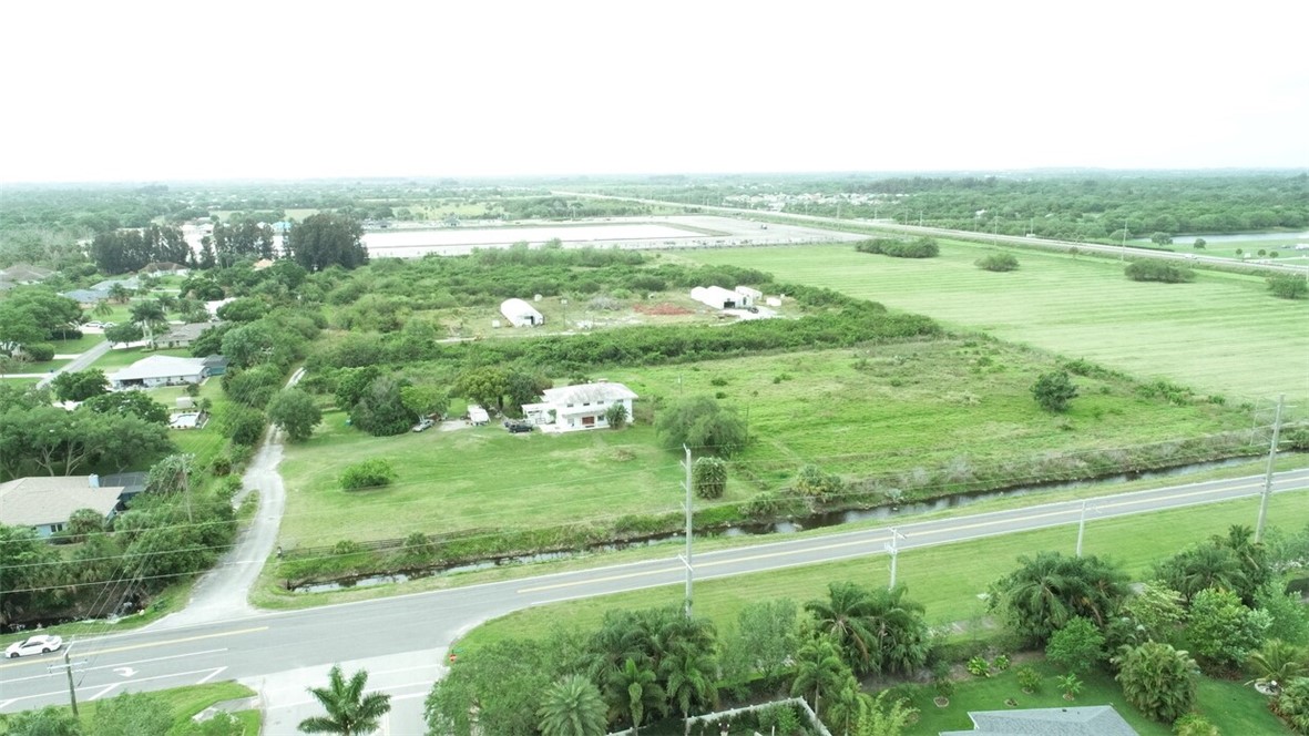 a view of a field with an ocean