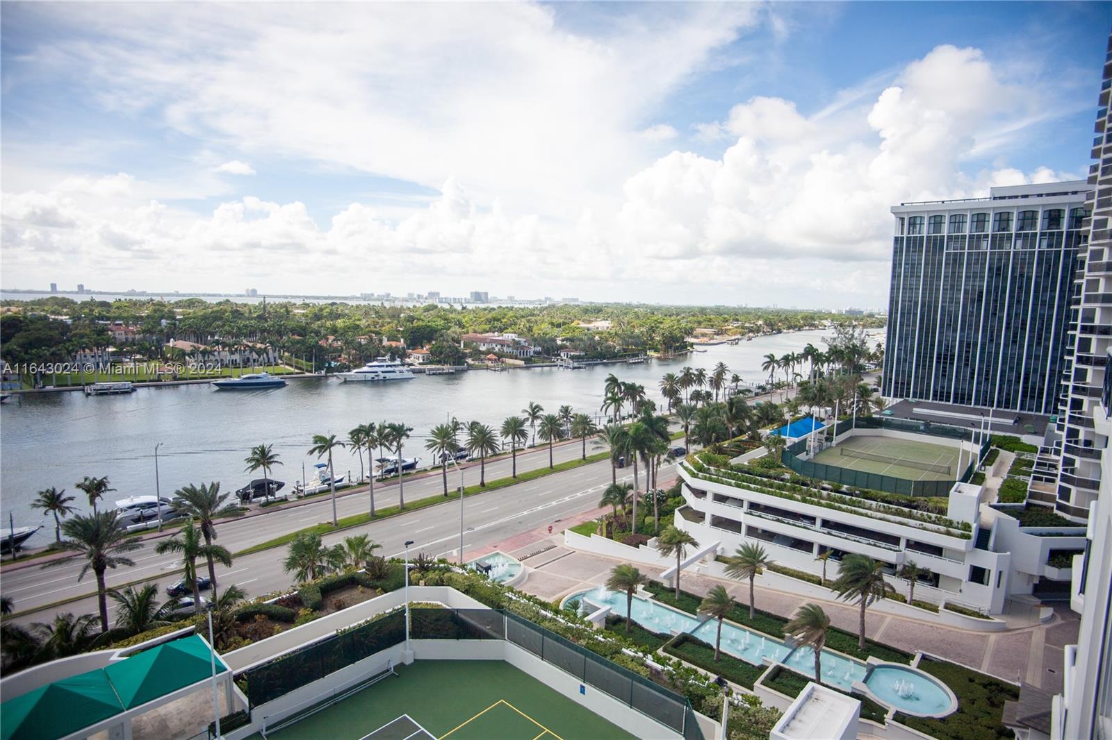 a view of a lake with tall buildings