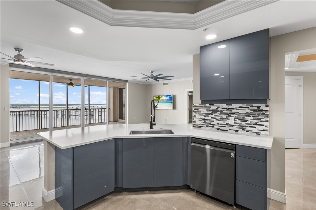 a kitchen with a sink and large window