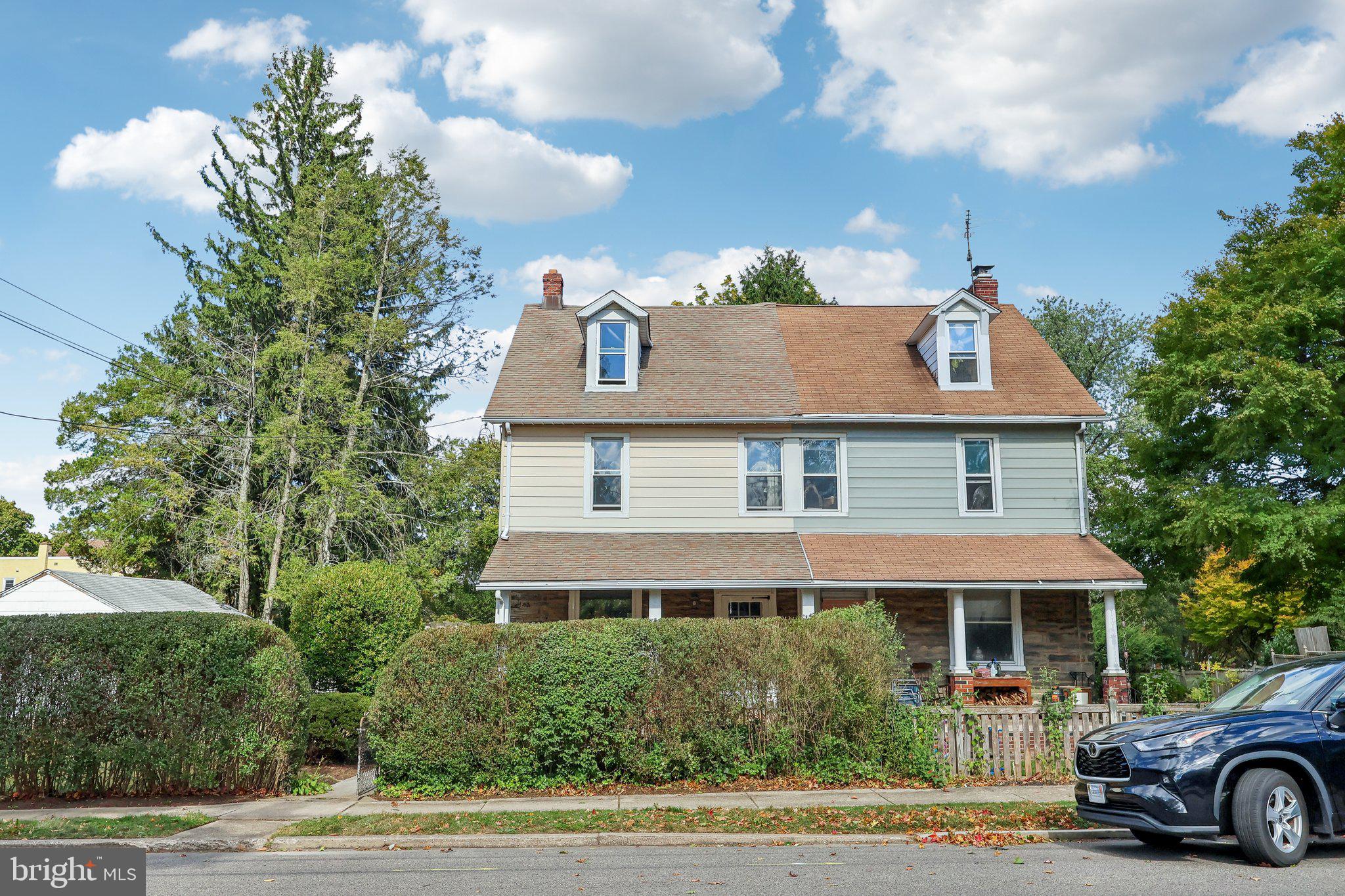 House with roof of garage on left