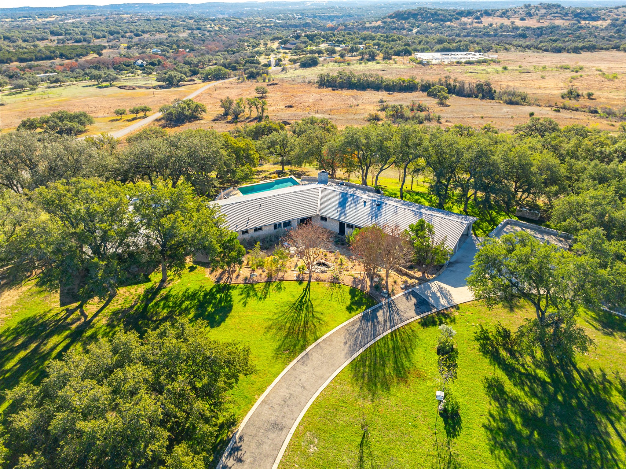 an aerial view of residential houses with outdoor space