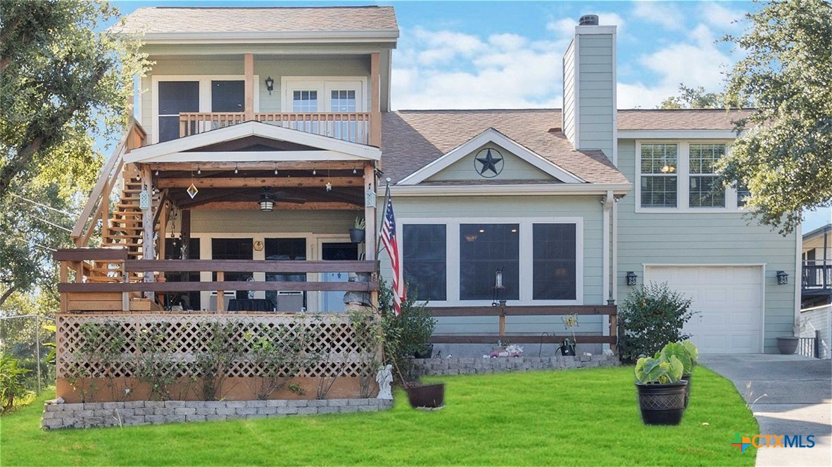 a front view of a house with a yard table and chairs