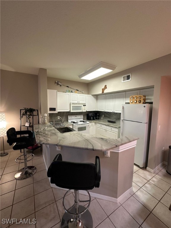 a kitchen with stainless steel appliances kitchen island granite countertop a sink and cabinets