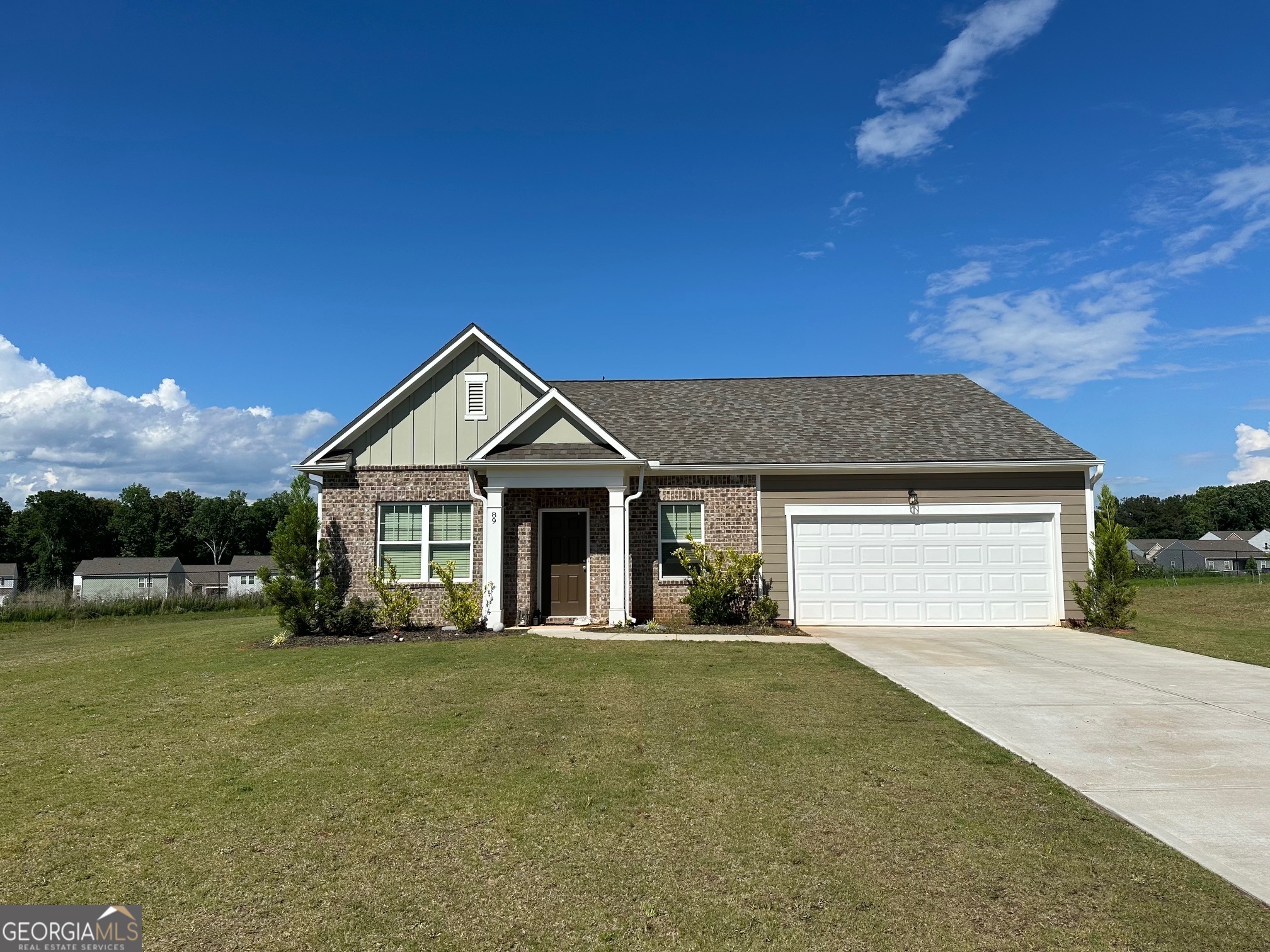 a front view of a house with yard