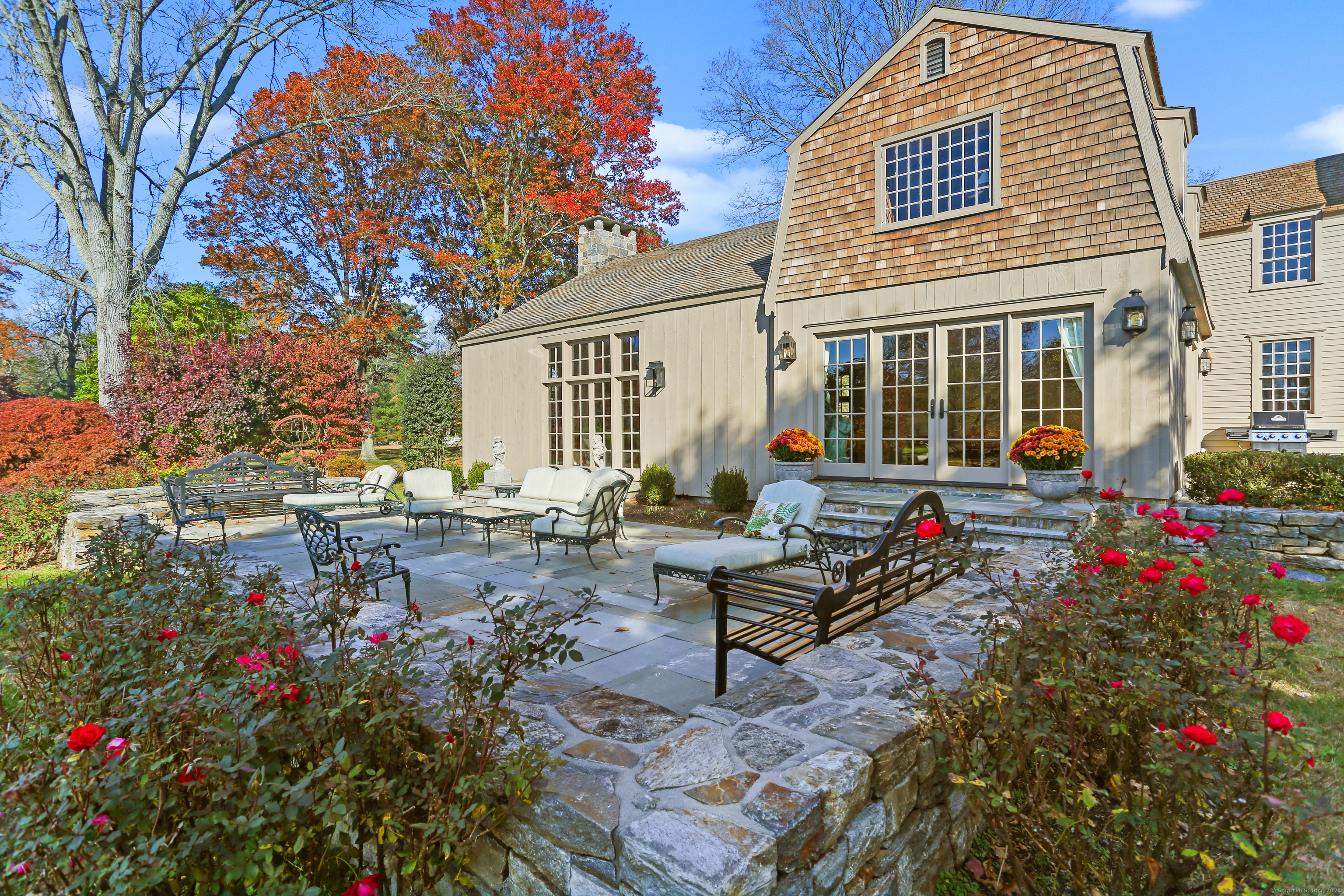 a view of a house with sitting area and garden