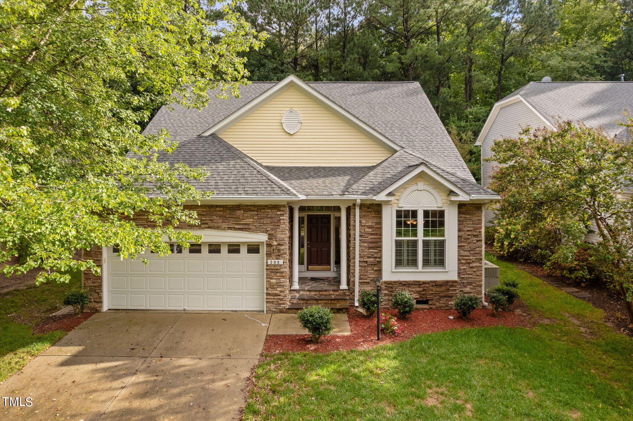 an aerial view of a house with yard