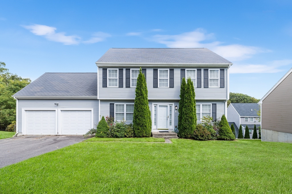 front view of a house with a yard